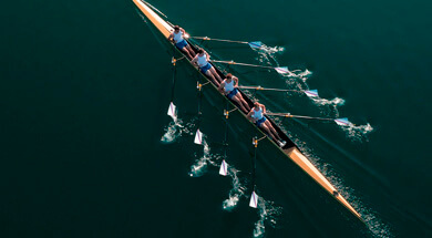Rowers work together as part of a team.