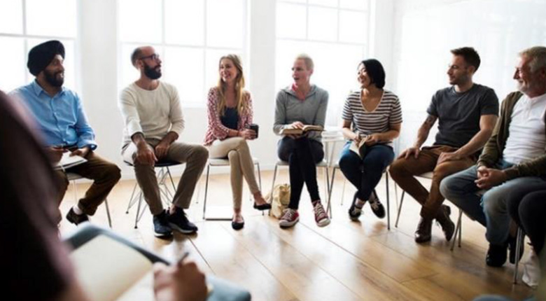 Community discussion group sitting in a circle