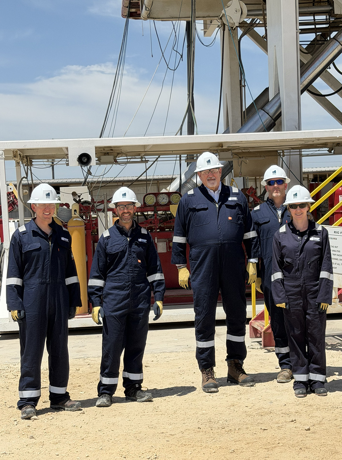 Deep Isolation team with Doug True from NEI standing in front of a rig at the DBDC in Cameron, TX